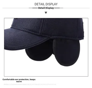 Detail view of the navy blue winter baseball cap featuring warm foldable ear flaps