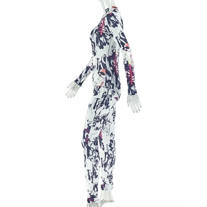 Detail view of skin-tight bodysuit featuring abstract ink print and geometric patterns