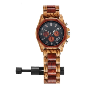 Detail of sandalwood multi-function watch featuring octagonal bezel and strap adjustment tool