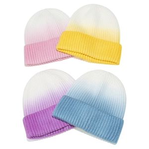 Set of four ombre gradient ribbed knit beanies in pink yellow purple and blue for winter