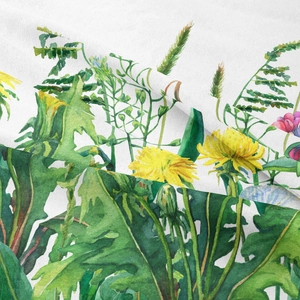 Detailed close-up of vibrant watercolor dandelion floral print on soft bohemian fabric