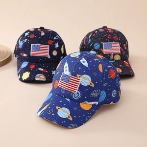 Close-up of space planet print and embroidered American flag patch on kids' baseball caps