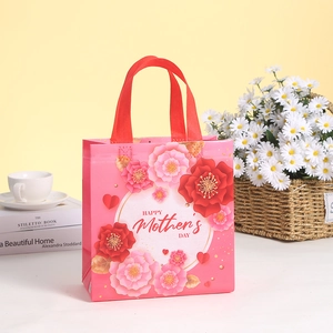 Pink Mother's Day non-woven gift bag with floral prints and red handles for shopping