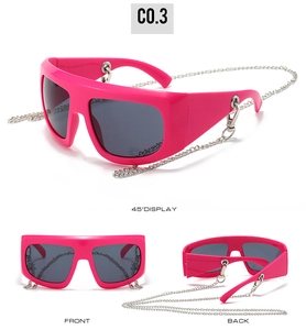 Detail of rose red Y2K oversized sunglasses with silver chain on white background