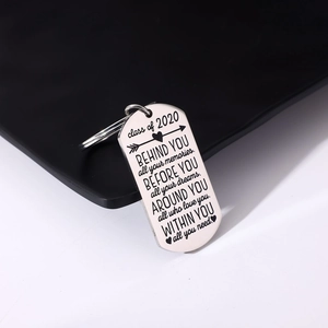 Macro detail of engraved Class of 2020 graduation military tag keychain in brushed steel