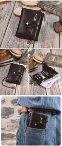 Macro view of short tri-fold vintage leather wallet with metal anti-theft chain detail