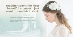 Exquisite white floral bridal hair accessory with pearls and crystals on a model