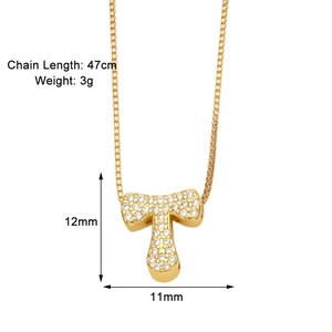 Detail view of a gold plated letter T necklace with cubic zirconia and measurements