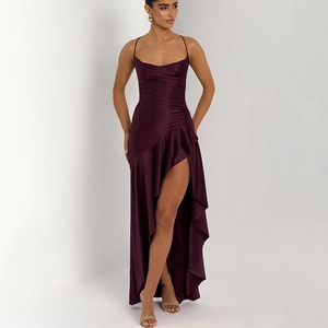 Detail of elegant dark purple satin dress featuring slim straps and high slit ruffled hem