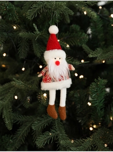 Detail of plush Santa Claus ornament with red knit sweater on a green Christmas tree