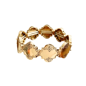 Bracelet extensible doré vintage avec motifs floraux de trèfle et gravures élégantes