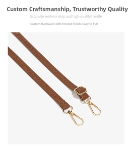 Detail of brown leather strap with adjustable matte gold buckle and metal hooks