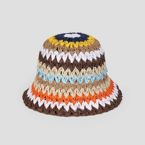 Macro detail of colorful wave pattern crochet knit on a foldable straw bucket hat