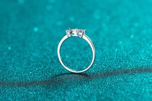 Macro shot of S925 sterling silver ring featuring double moissanite stones in prong setting