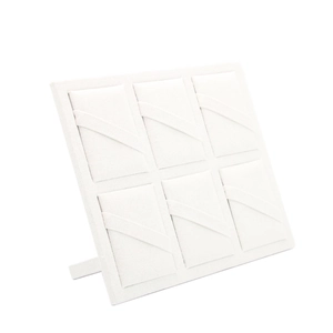 Minimalist 6-slot jewelry display board in cream linen with foldable back support