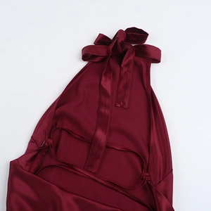 Detail of the lace-up open back design on this elegant burgundy satin maxi dress