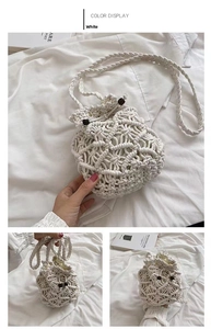 Detail of white cotton woven bucket bag featuring drawstring closure and wooden beads