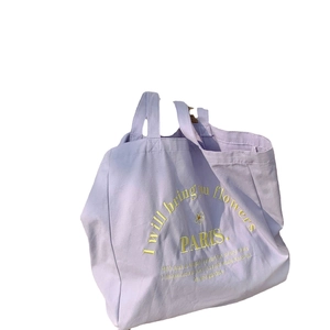 Minimalist lavender canvas tote bag with yellow PARIS embroidery and floral typography