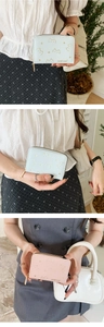 Detailed view of light blue and pink PU leather wallets with cute cat gold embossing