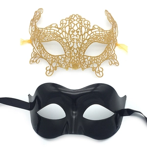 Detail of gold lace floral mask and black glossy eye mask set for masquerade parties