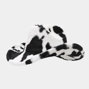 Detailed view of the fluffy faux fur texture on this black and white cow print cowboy hat