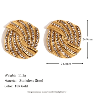Detailed view of 18K gold plated stainless steel swirl earrings with micro-set diamonds