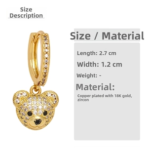 Detailed view of bear earrings with 18K gold plating and sparkling zircon stones
