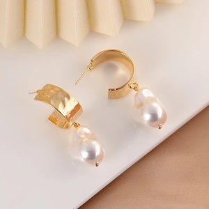 French vintage gold C-shape earrings featuring textured water ripples and baroque pearls
