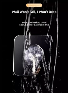 Waterproof clear adhesive hook detail showing strong grip under splashing water