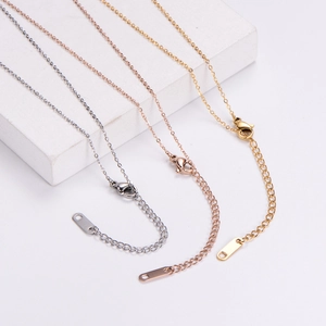 Detail of adjustable metal chains in silver gold and rose gold with lobster clasps