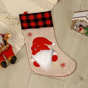 Nordic style linen Christmas stocking with gnome applique and red plaid cuff decoration