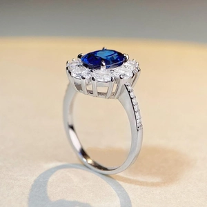 S925 sterling silver ring with blue oval gemstone and white cubic zirconia accents