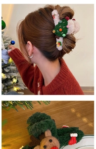 Detail of Christmas plush hair clips featuring reindeer and tree designs on a soft texture