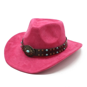 Detail of rose pink suede cowboy hat featuring vintage leather band and turquoise studs