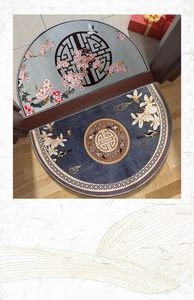 Close-up of semi-circular door mats with traditional Chinese floral and bird patterns
