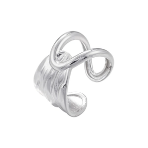 Macro shot of silver irregular wrap-around ear cuff with textured metal finish