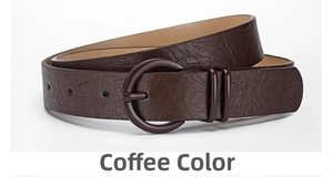 Detail of coffee brown PU leather belt with round pin buckle and lychee texture
