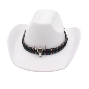 Detail view of a white western cowboy hat featuring an ethnic band and bull skull.