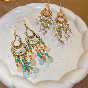 Bohemian style gold moon earrings with colorful beads and vintage drop dangle design