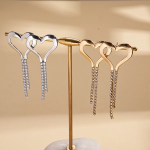 Elegant gold and silver hollow heart tassel earrings with sparkling cubic zirconia
