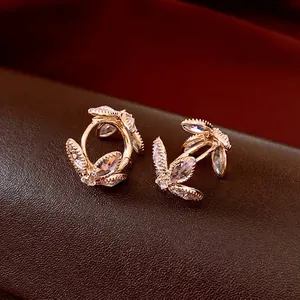 French vintage gold hoop earrings with leaf-shaped marquise zircons on leather