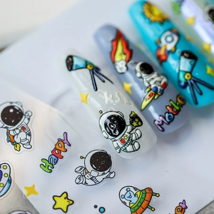 Autocollants à ongles 3D thème espace avec astronautes et fusées sur ongles bleus