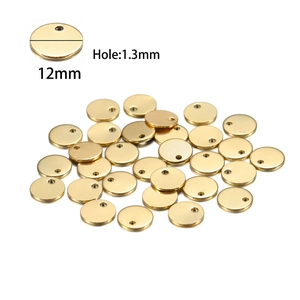 Macro detail of 12mm golden stainless steel round pendants with 1.3mm hole size