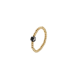 Detailed close-up of golden beaded elastic ring featuring a central black zircon gemstone