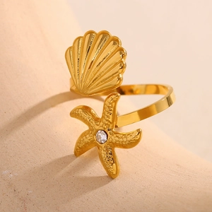 Detailed macro of 18K gold plated shell and starfish adjustable ring with zircon