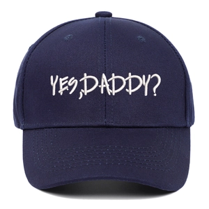 Navy blue cotton baseball cap with white Yes Daddy embroidery and curved brim