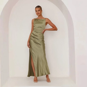 Detail of olive green satin maxi dress showing the side slit and smooth fabric texture