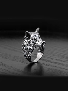 Detailed close-up of a vintage wolf head ring with intricate fur textures and punk design