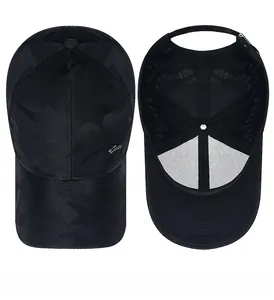Detail view of black camouflage baseball cap showing internal mesh lining and top structure