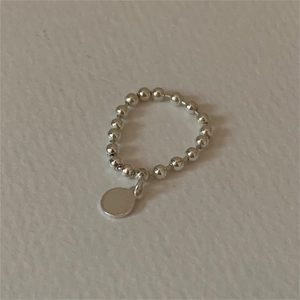Minimalist 925 sterling silver beaded ring featuring a solid round dangling pendant charm